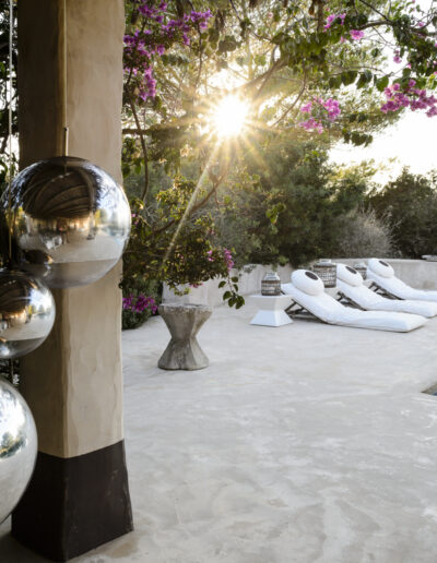 light shining through artistic decoration on the terrace of Villa Carlos for rent in cap de barberia in formentera