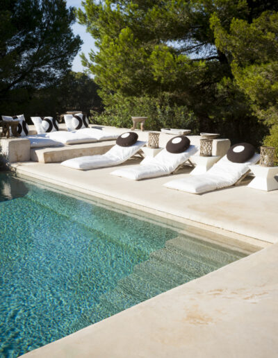 getting bronzed by the cristalline swimming pool of Villa Carlos for rent in formentera